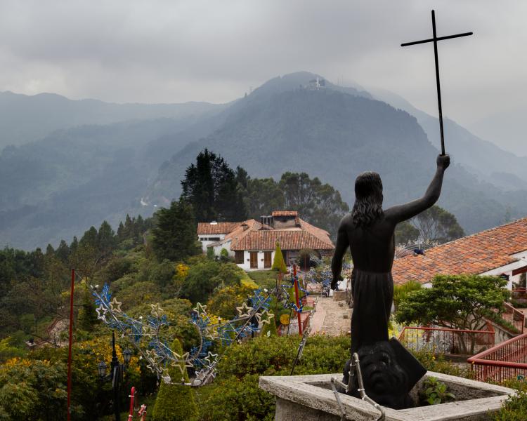 Religious sculpture with a cross in his hand on the holy mountain in Bogota. Credit: Ingrid A Grants,  Shutterstock 